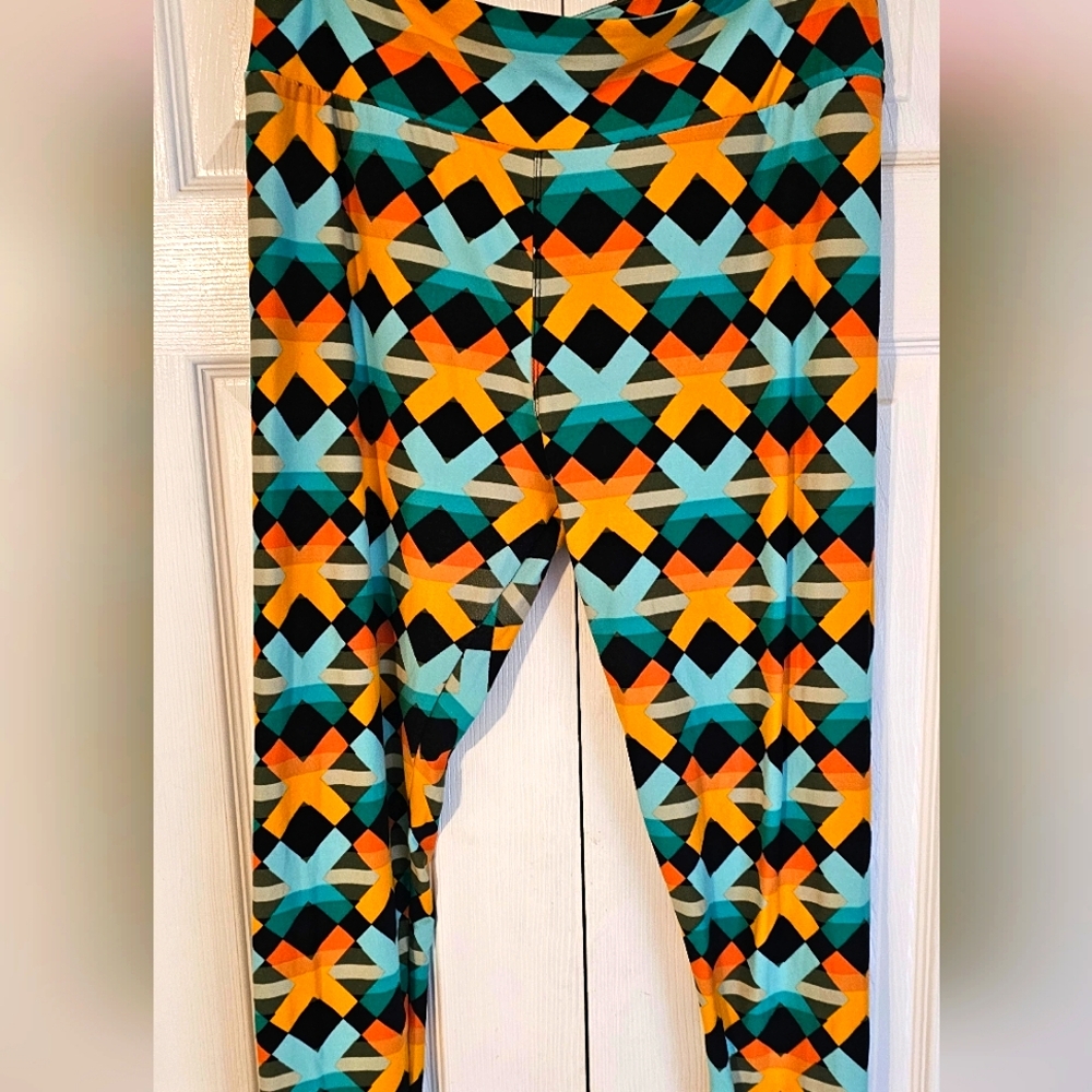 Like New LulaRoe Leggings Black with orange and blue x's. Tall and Curvy
